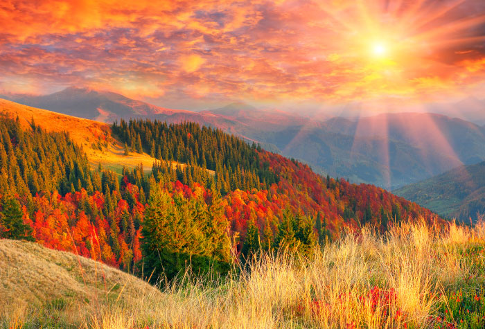 mountains in fall with sun shining